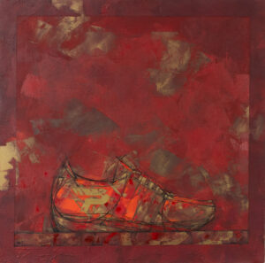 Sneaker sur fond rouge